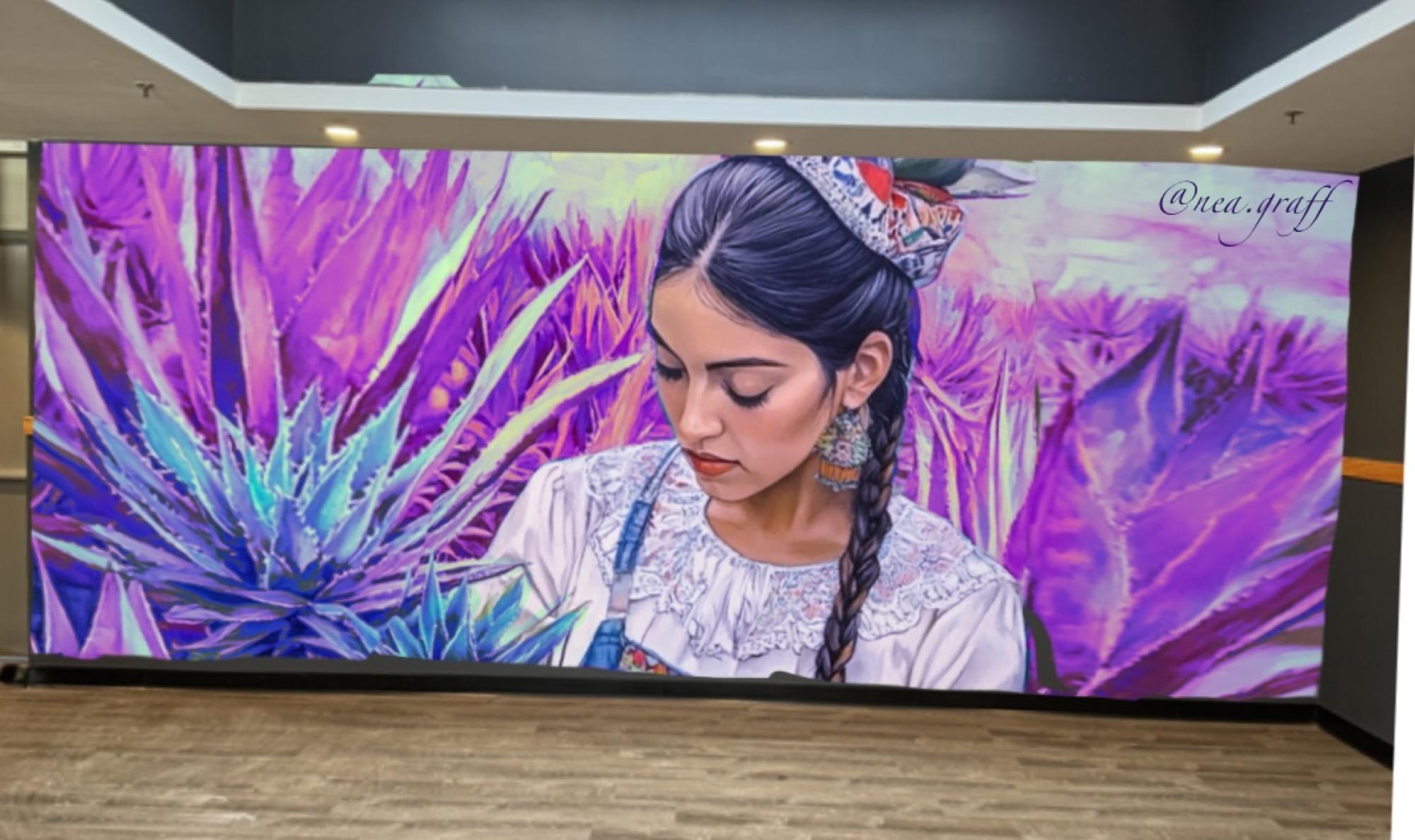 Interior mural of a woman in traditional dress among purple agave plants