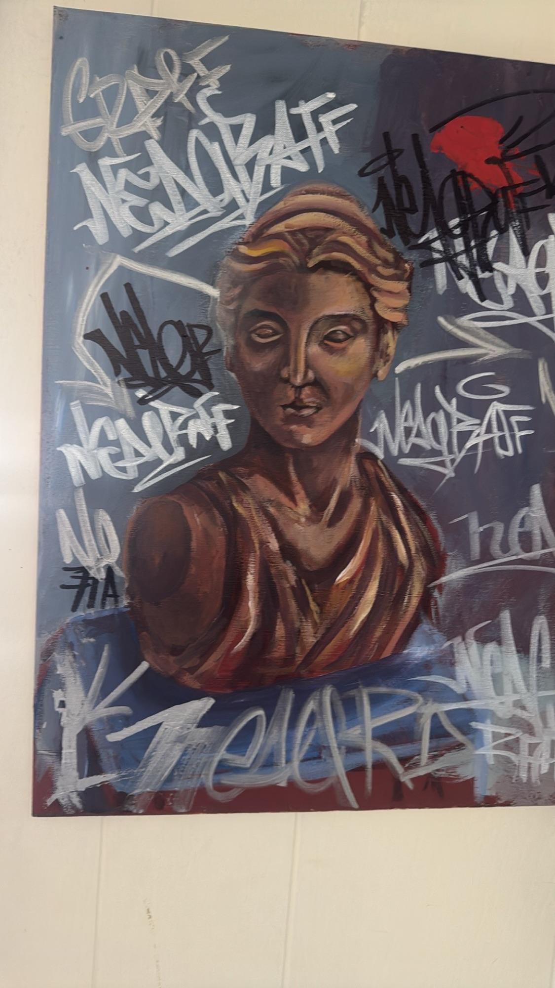 Painted profile of a woman with graffiti lettering around her